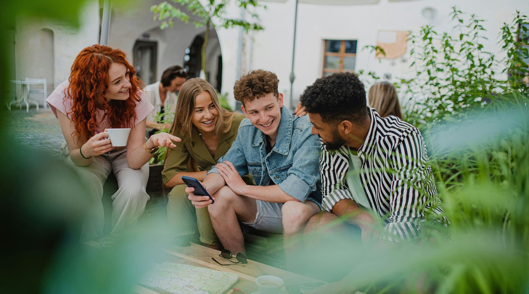A group of people sitting with each other.
