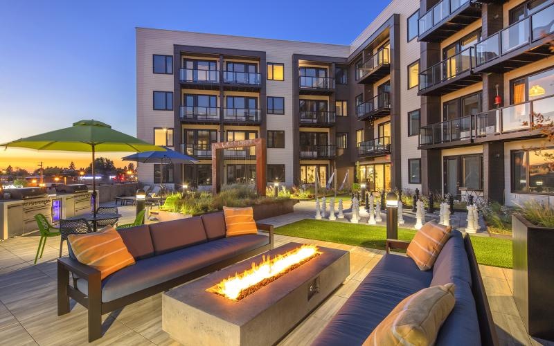 a fire pit in a courtyard of a building