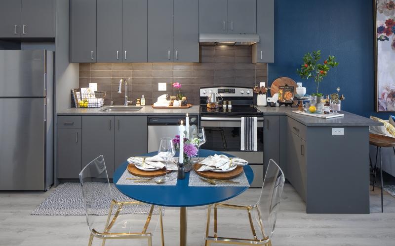 a kitchen with a table and chairs